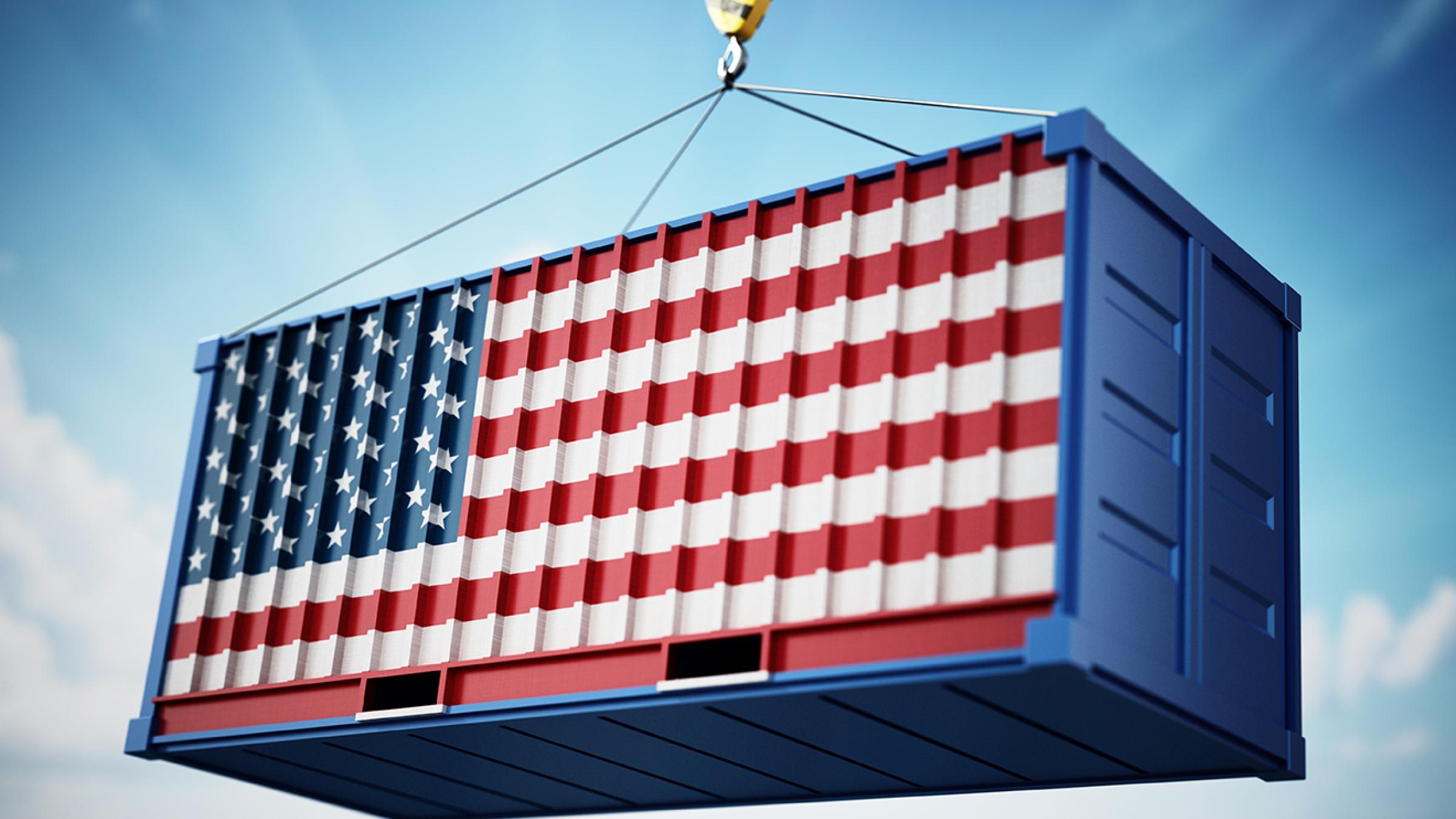 Shipping container with U.s. flag on side of it.