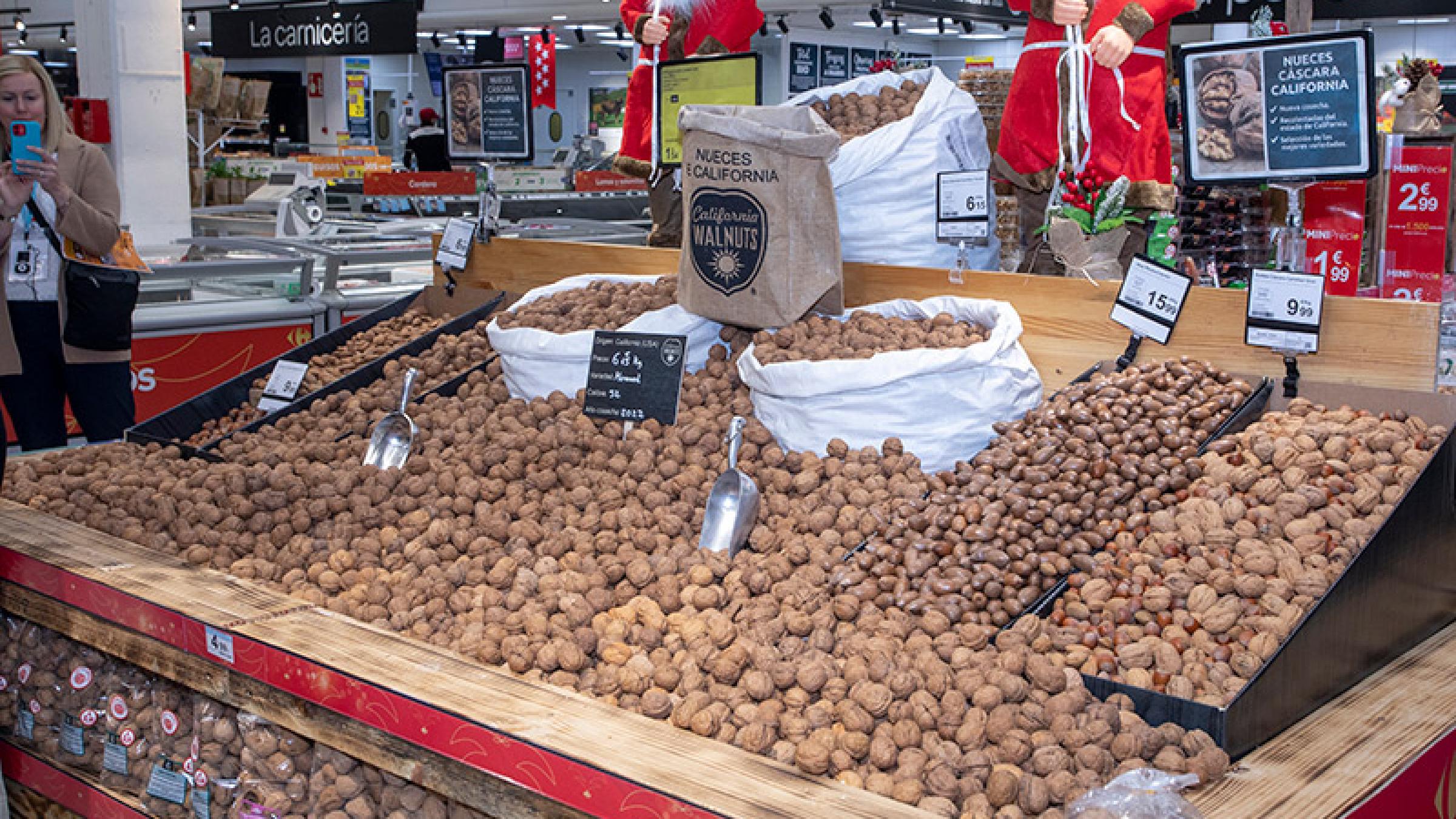 Photo of loose walnuts in a grocery store during the holidays