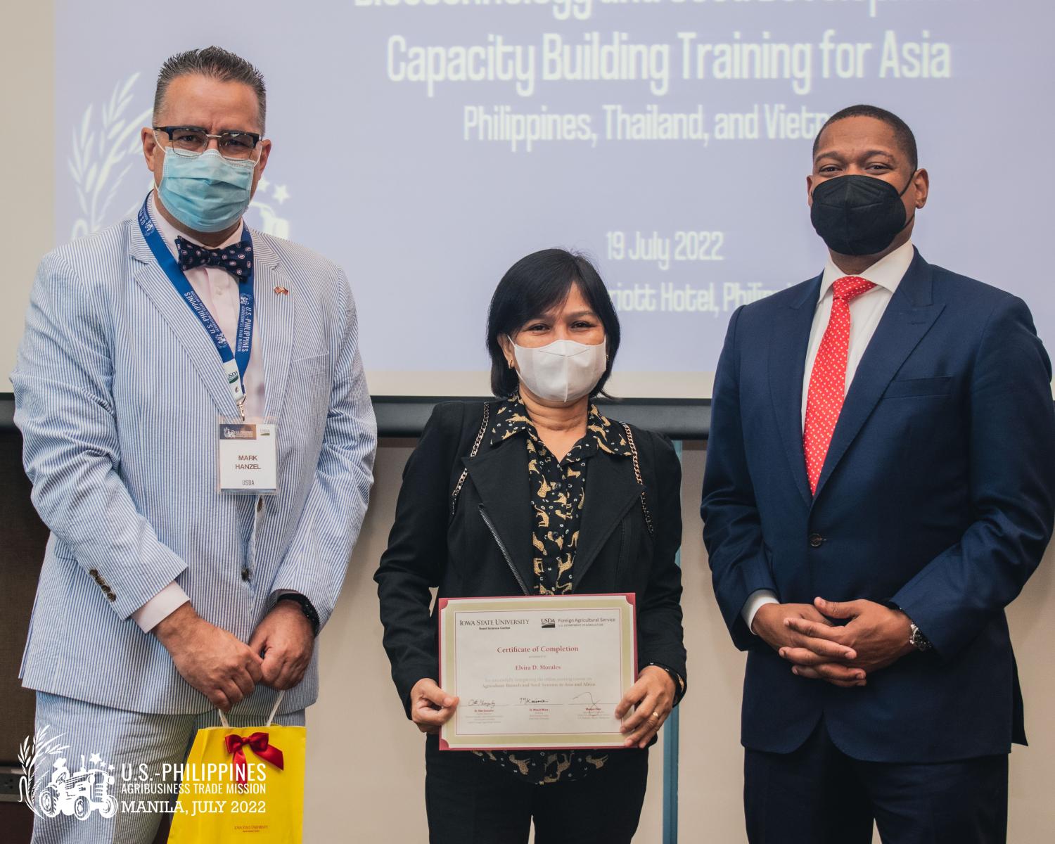 Administrator Whitley awards certificates to the participants of the FAS-funded biotechnology training, in partnership with Iowa State University, to improve knowledge of biotech regulations and seed systems. Here is Administrator Whitley with Agriculture Attaché to the Philippines, Mark Hanzel, and Elvira Morales at the ceremony.