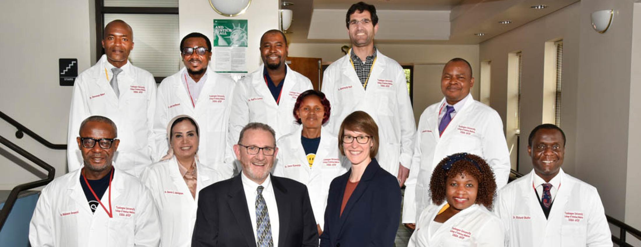 FAS Deputy Administrator Mark Slupek and FAS Program Manager Chris Biles visit with the 10 Faculty Exchange Program Fellows studying at Tuskegee University.